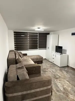 a living room with two beds and a couch at Studio Ivana 3 in Soko Banja