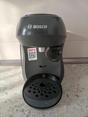 a black coffee maker sitting on a counter at Gold Apartman in Kruševac