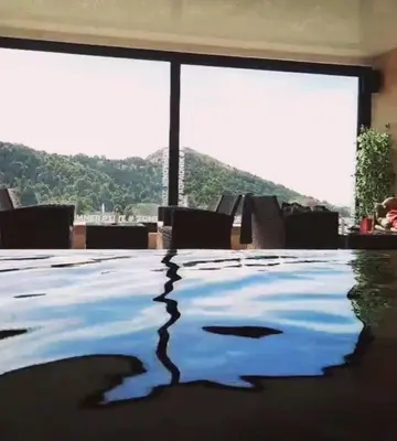 a room with a pool with a view of a mountain at Apartman Milovan in Kopaonik