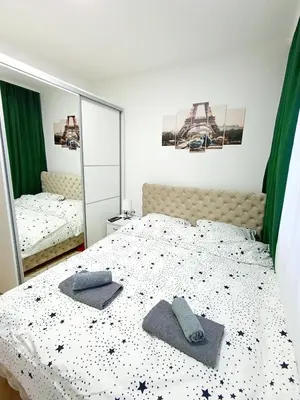 a bedroom with a bed with two pillows on it at MSapartman in Vrnjačka Banja