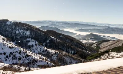 an aerial view of a snow covered mountain at Apart-Hotel Ariš Kopaonik in Kopaonik
