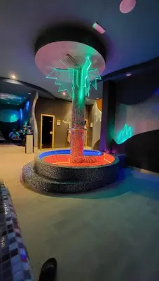 a room with a fountain in the middle of a room at Kopaonik Apartman Nina in Kopaonik