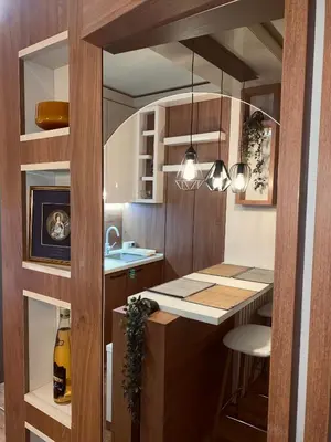 a kitchen with a counter and a island in a room at Kopaonik Apartman Nina in Kopaonik