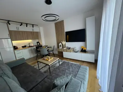 a living room with a couch and a table at Apartman S in Vrnjci
