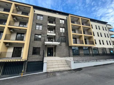 an apartment building with stairs in front of it at Apartman S in Vrnjci
