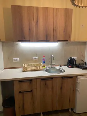 a kitchen counter top with a sink and a sink at Apartman Vuk, Crni Vrh - Stara planina in Crni Vrh