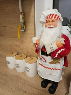 a santa claus figurine standing next to some cups at Jokica apartmani in Paraćin