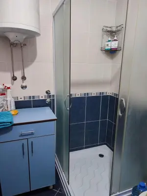 a bathroom with a shower with a glass door at Smeštaj Vesna in Soko Banja