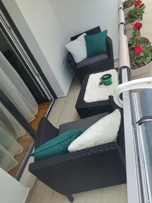 a living room with two chairs and a couch at Sofika in Vrnjačka Banja