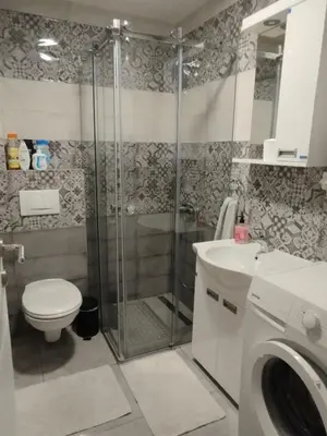 a bathroom with a shower and a toilet and a sink at Sofika in Vrnjačka Banja