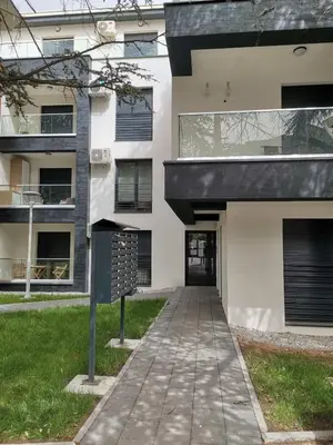 a building with a walkway in front of it at Sofika in Vrnjačka Banja
