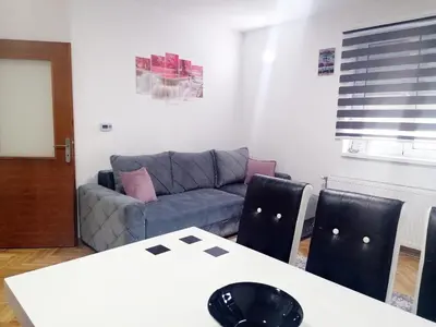a living room with a couch and a table at Apartman Cvetkovic in Vrnjačka Banja