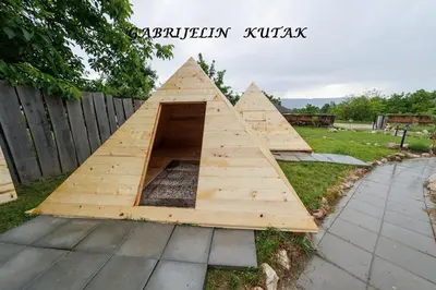 a pyramid house is laying on the grass at Gabrielin kutak in Mužinac