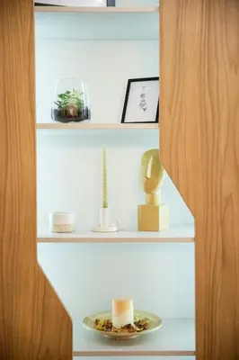 a shelf with candles and a plate on it at Luka's apartment in Pirot