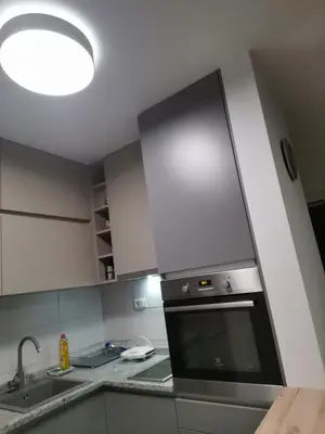 a kitchen with a sink and a stove top oven at Janković in Vranje