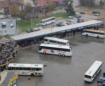 a group of buses parked in a parking lot at Janković in Vranje