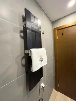 a towel hanging on a wall in a bathroom at Coco Kop studio in Kopaonik