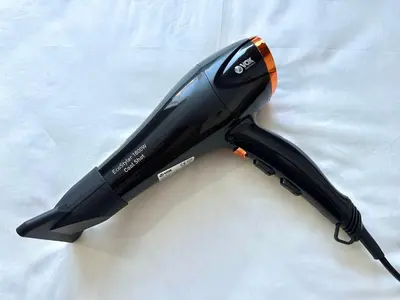 a hair dryer sitting on top of a white sheet at Coco Kop studio in Kopaonik