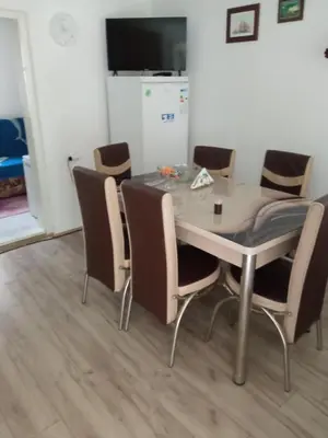 a dining room table with chairs around it at Seosko turisticko domacinstvo Milanovic in Žuč