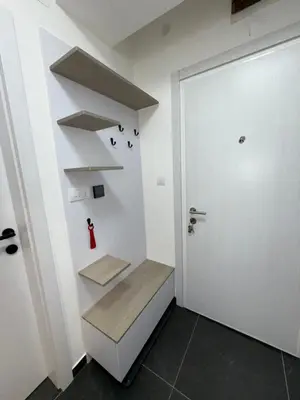 a room with a white door and a stair case at Mint2 in Kopaonik