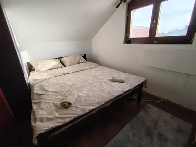 a small bed in a room with a window at Drašković lux Goč in Goč