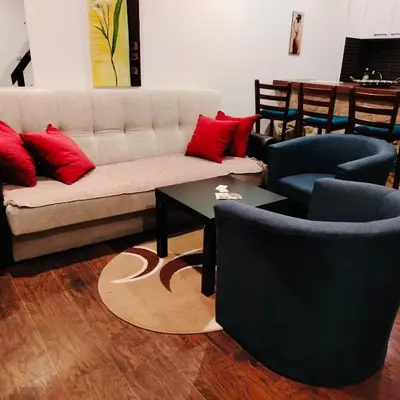 a living room with a couch and two chairs and a table at Drašković lux Goč in Goč