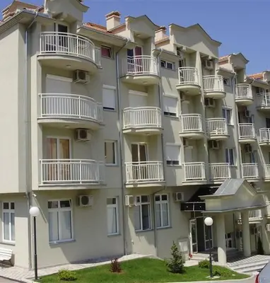 a large apartment building with white balconies at Smeštaj Galerija in Soko Banja