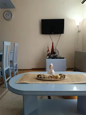 a table with a santa clause sitting on top of it at Apartman Fazan in Vrnjačka Banja