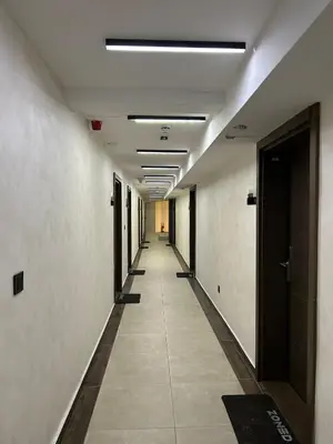 an empty hallway of an office building with a long corridor at Apartman Minja - Hotel Zoned Kopaonik in Kopaonik