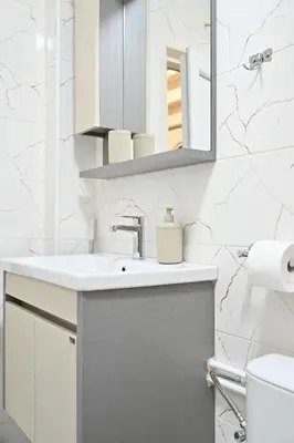 a bathroom with a sink and a mirror at Studio Idila in Raška