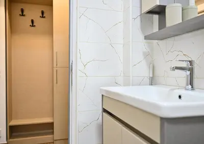 a bathroom with a sink and a shower at Studio Idila in Raška