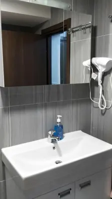 a bathroom with a white sink and a mirror at Kraljevi Cardaci SPA Aartment 1027 für 6 Personen in Kopaonik