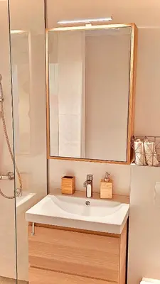 a bathroom with a white sink and a mirror at Studio 4 in Pirot
