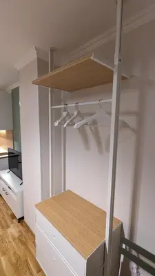 a room with a closet with shelves and a desk at Studio 4 in Pirot