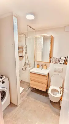 a bathroom with a toilet and a shower and a sink at Studio 4 in Pirot