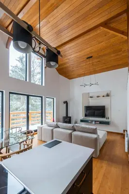 a living room with a couch and a table at Gorska Vila in Kopaonik