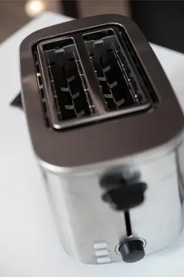 a close up of a toaster sitting on a table at Gorska Vila in Kopaonik