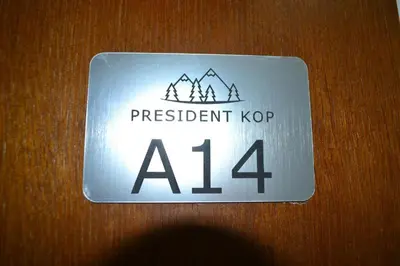 a sign that says persistent kop on a door at A 14 President Kopaonik in Raška