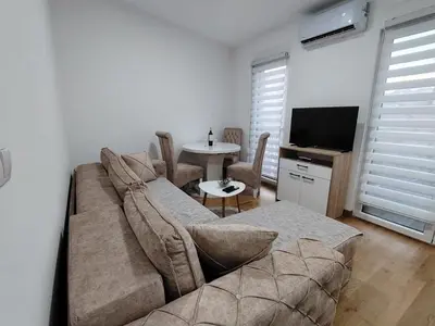 a living room with a couch and a table at Apartman Peca in Vrnjci