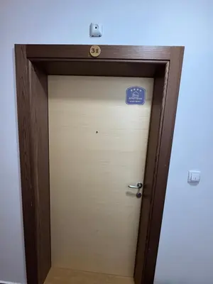 a elevator door with a sign on top of it at Eli's APARTMENT 31 in Brzeće