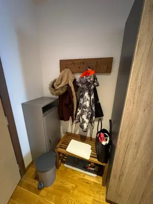 a small room with a bed and a cabinet at Eli's APARTMENT 31 in Brzeće