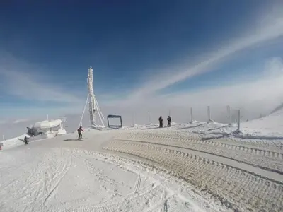 a group of people skiing on a snow covered slope at Eli's APARTMENT 31 in Brzeće