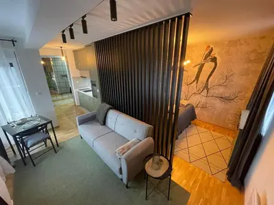 a living room with a couch and a table at VeronaLux in Vrnjci