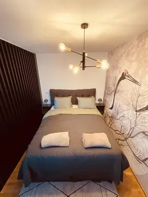 a bedroom with a bed with two white pillows at VeronaLux in Vrnjci