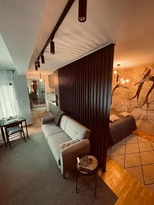 a living room with a couch and a table at VeronaLux in Vrnjci