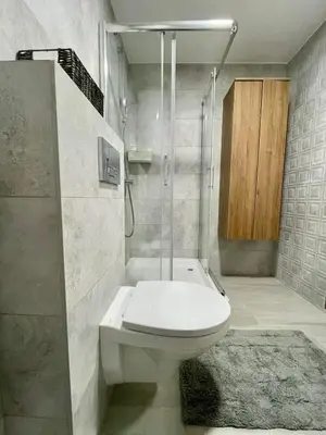 a bathroom with a shower with a toilet and a shower at VeronaLux in Vrnjci