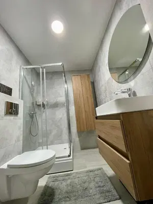 a bathroom with a shower and a toilet and a sink at VeronaLux in Vrnjci