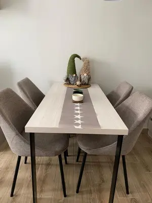 a dining room table with two chairs and a table with at Residence Hill Chill on Kop Apartment in Kopaonik