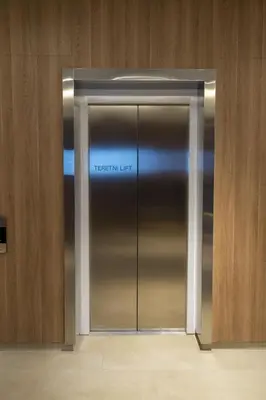 a metal elevator in a building with the words insertion limit at Planet Residence-Studio Solis in Niš