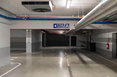 an empty parking garage with a sign that says walesadium at Planet Residence-Studio Solis in Niš